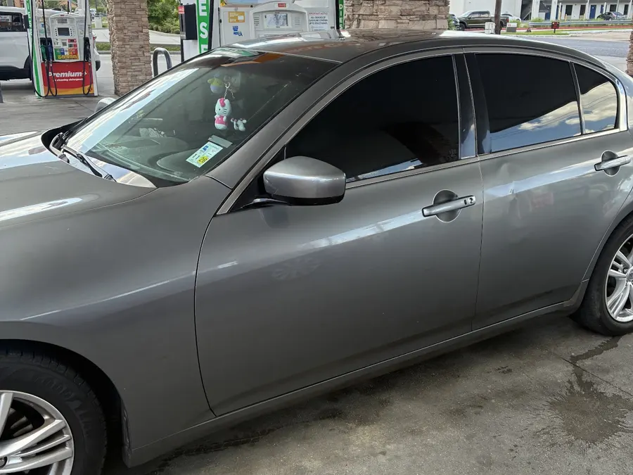 Grey Infiniti sedan with tinted windows