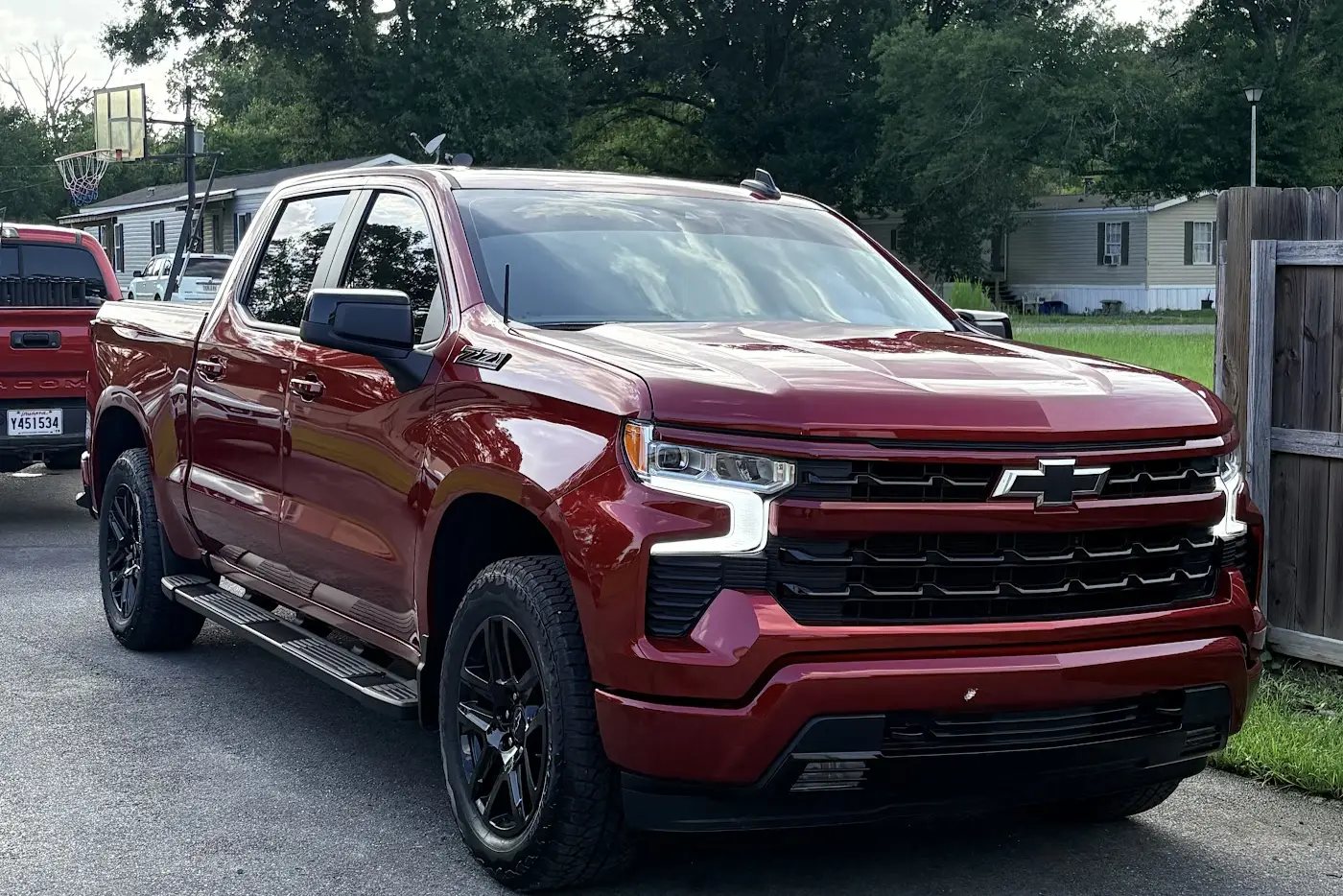 Red Chevy Silverado with ceramic window tint by Elite Tint & Glass