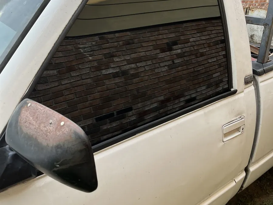 White pickup with dark rear window tint