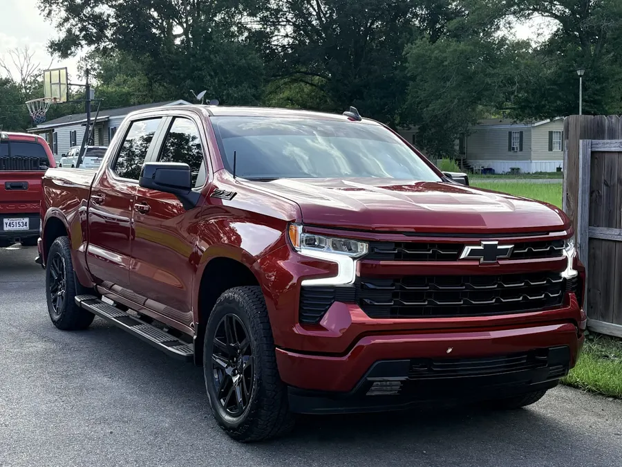 Red Chevy Silverado with fresh ceramic tint