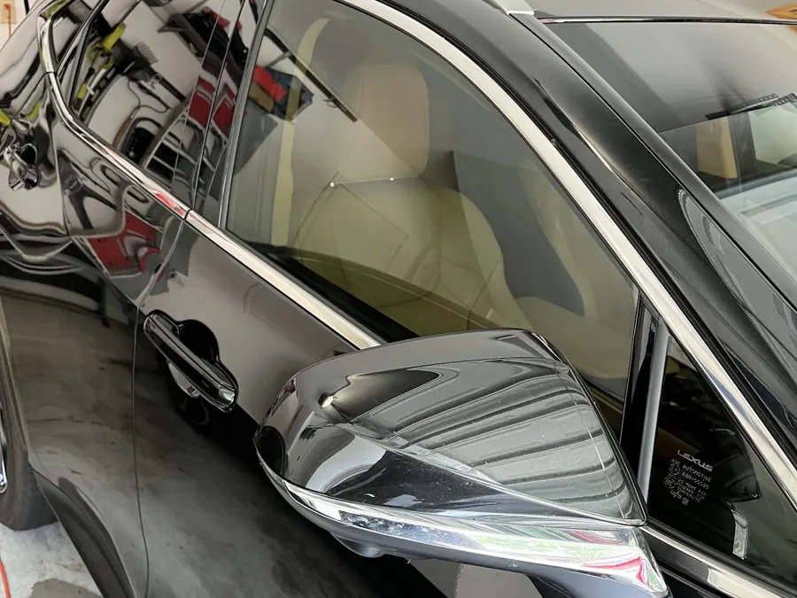 Black sedan getting mobile window tint installed